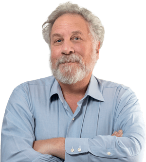 Professor Andrew Salzman, a Harvard MD, stands with his arms folded