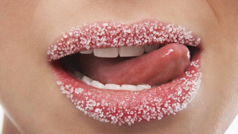 Close-up shot of lips sprinkled with sugar. Insulin sensitivity. NMN