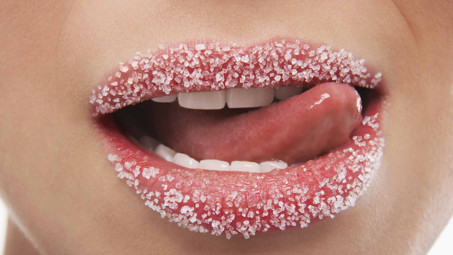 Close-up shot of lips sprinkled with sugar. Insulin sensitivity. NMN