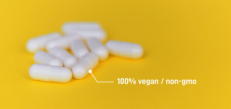 White manufactured NMN capsules show how they are vegan