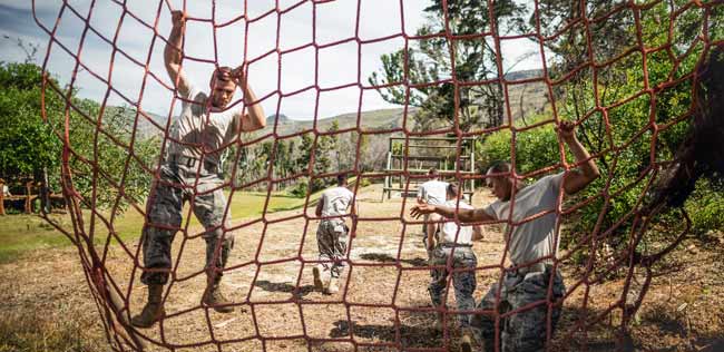 Soldiers navigating an obstacle course, symbolizing efforts to enhance performance and health